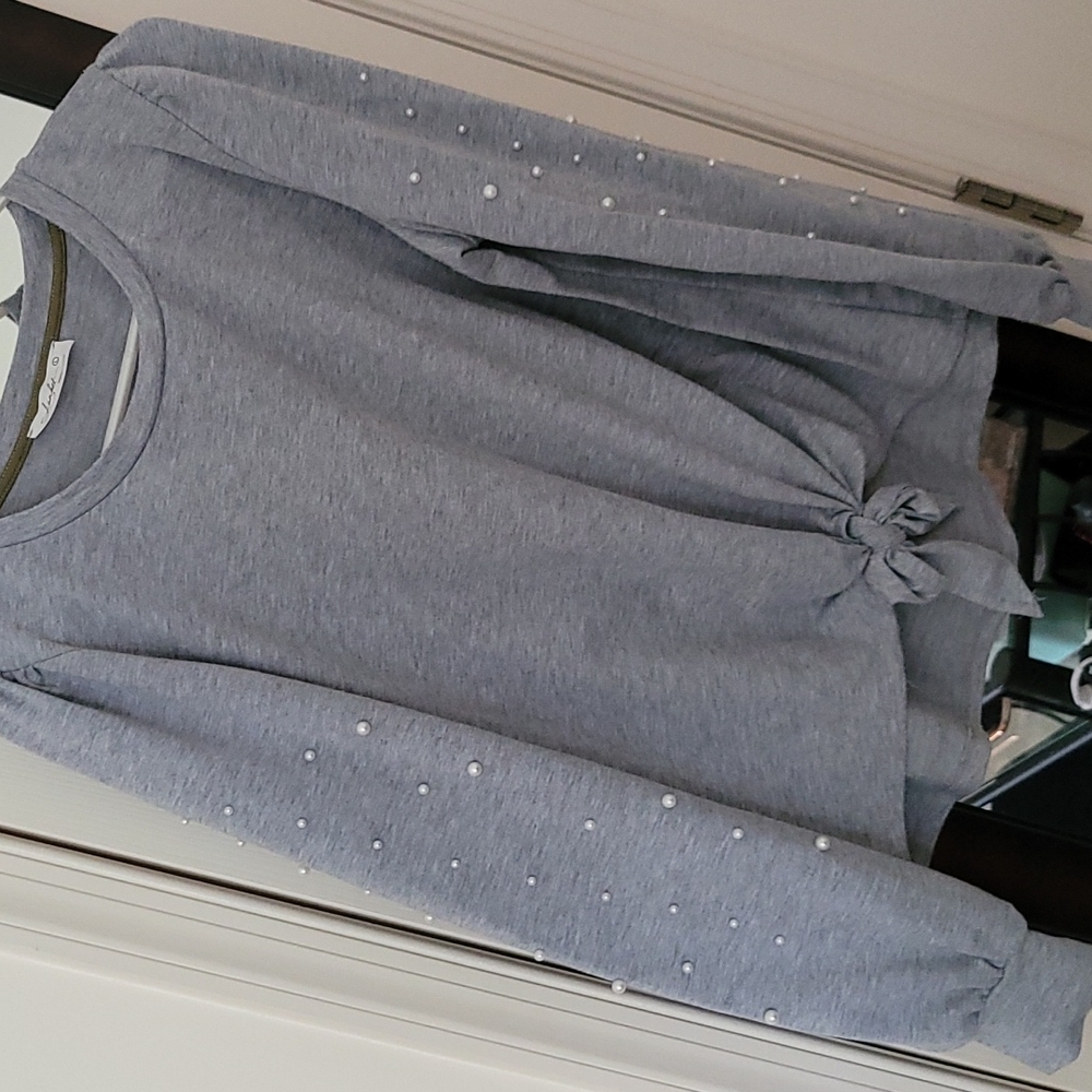 Grey top with pearls on sleeve